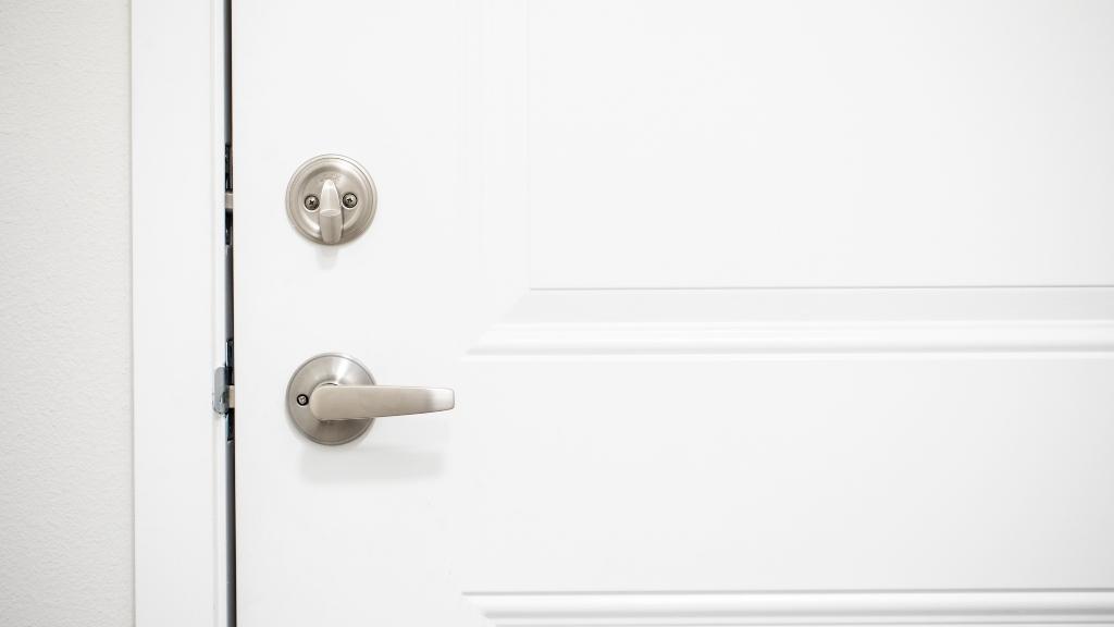 A door with a lever lock and deadbolt lock combination