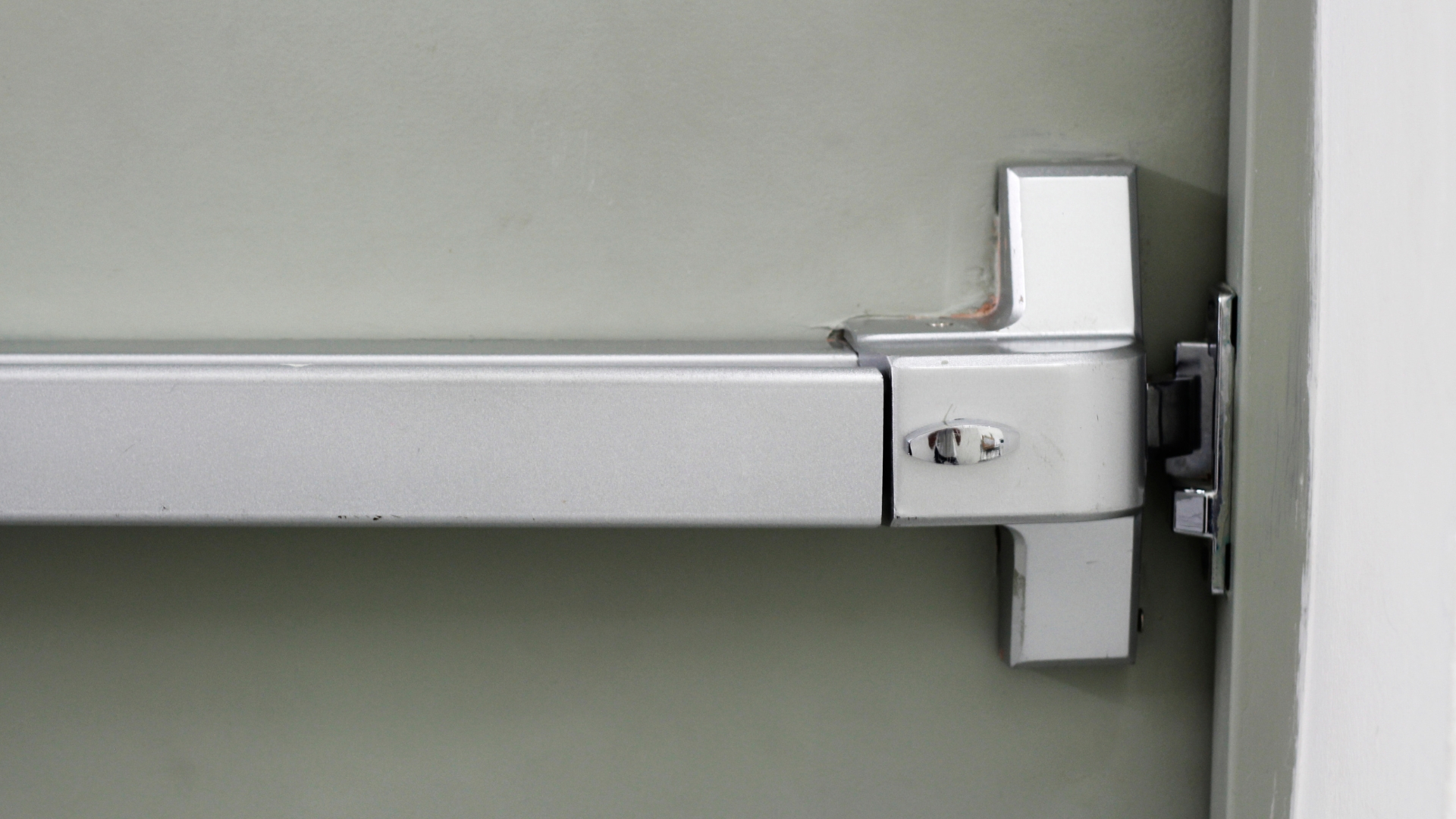A panic bar as part of a commercial door hardware