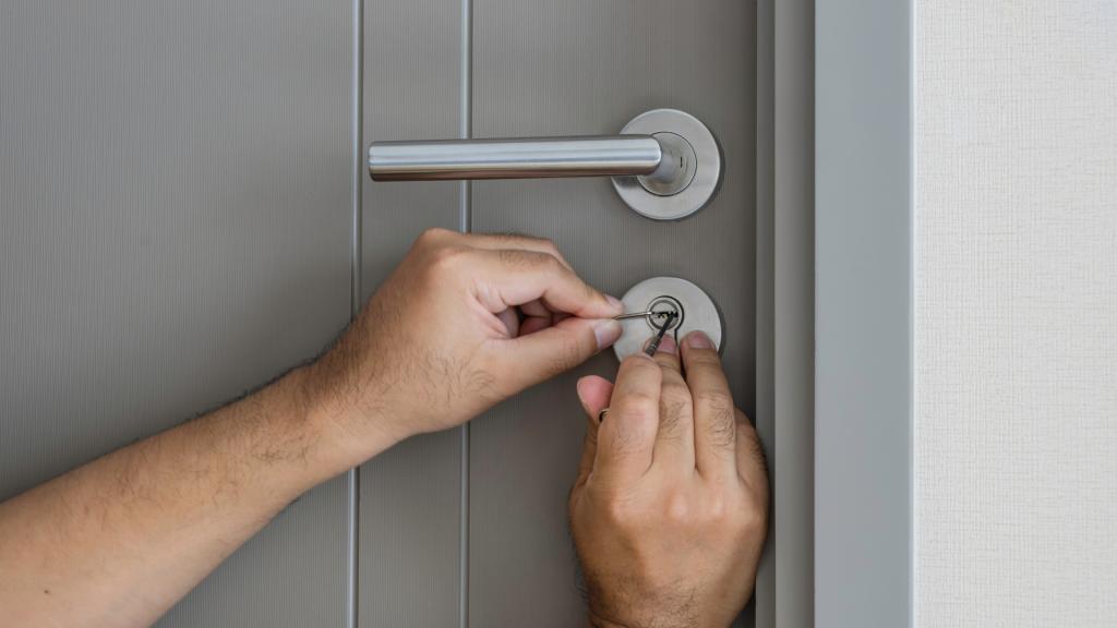 Close-up view of a locksmith picking a door lock to restore home access after a lockout