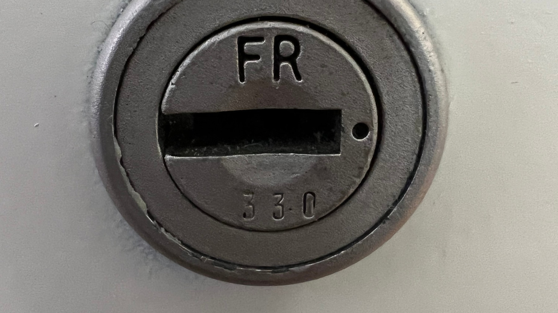 Commercial locksmith services in Beverly Hills, CA, showing a close-up of a metal lock cylinder and keyway.